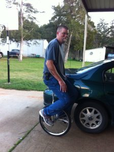 man on unicycle